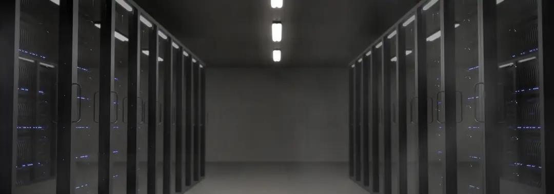 Aisle in a data centre lined with server racks